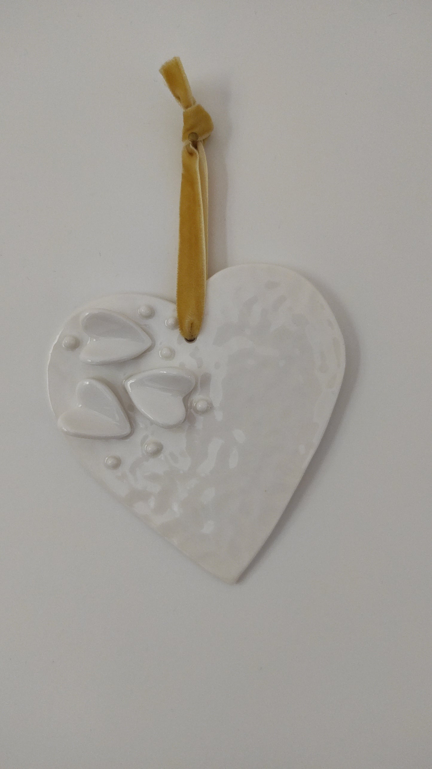 Trois petits coeurs sur un grand